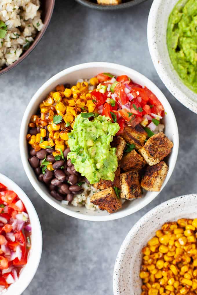 burrito bowl with tofu, pico de gallo, black beans, roasted corn and guacamole